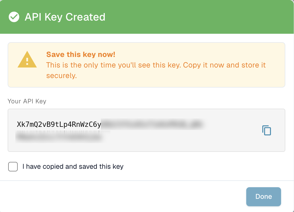 The API Key Created dialog showing the full key once